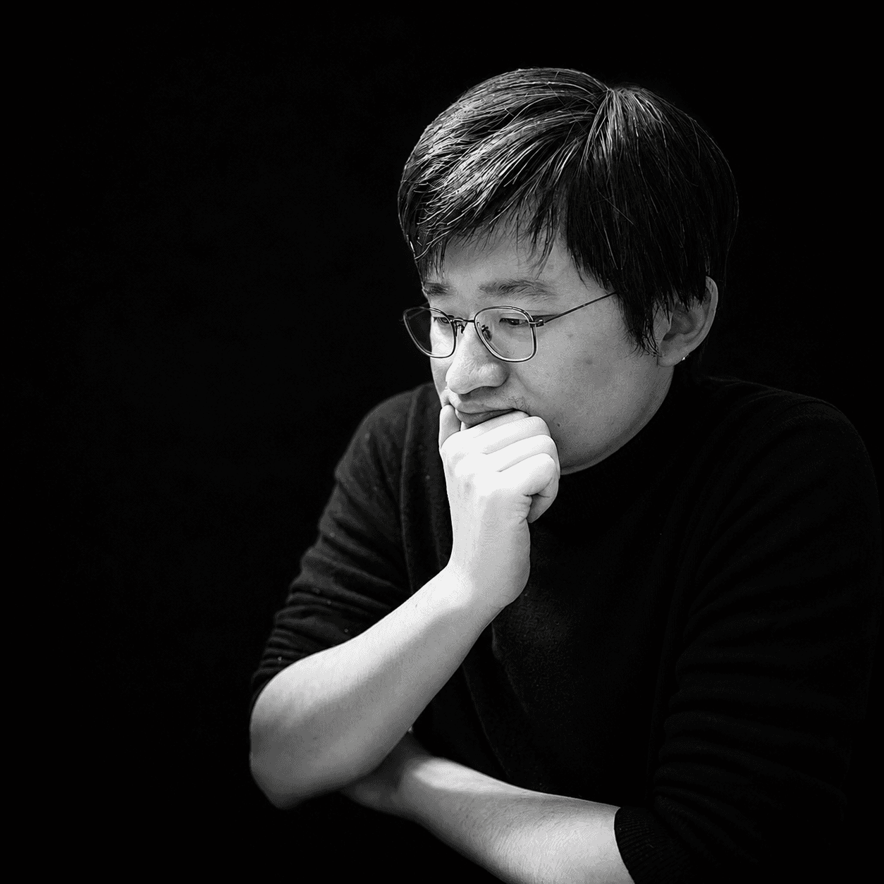 Black-and-white portrait of the expert
